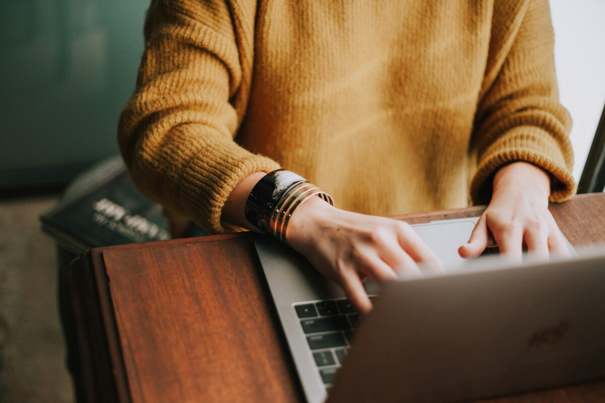 Solving SharePoint Document Chaos for Growing Toronto Teams woman working on her laptop